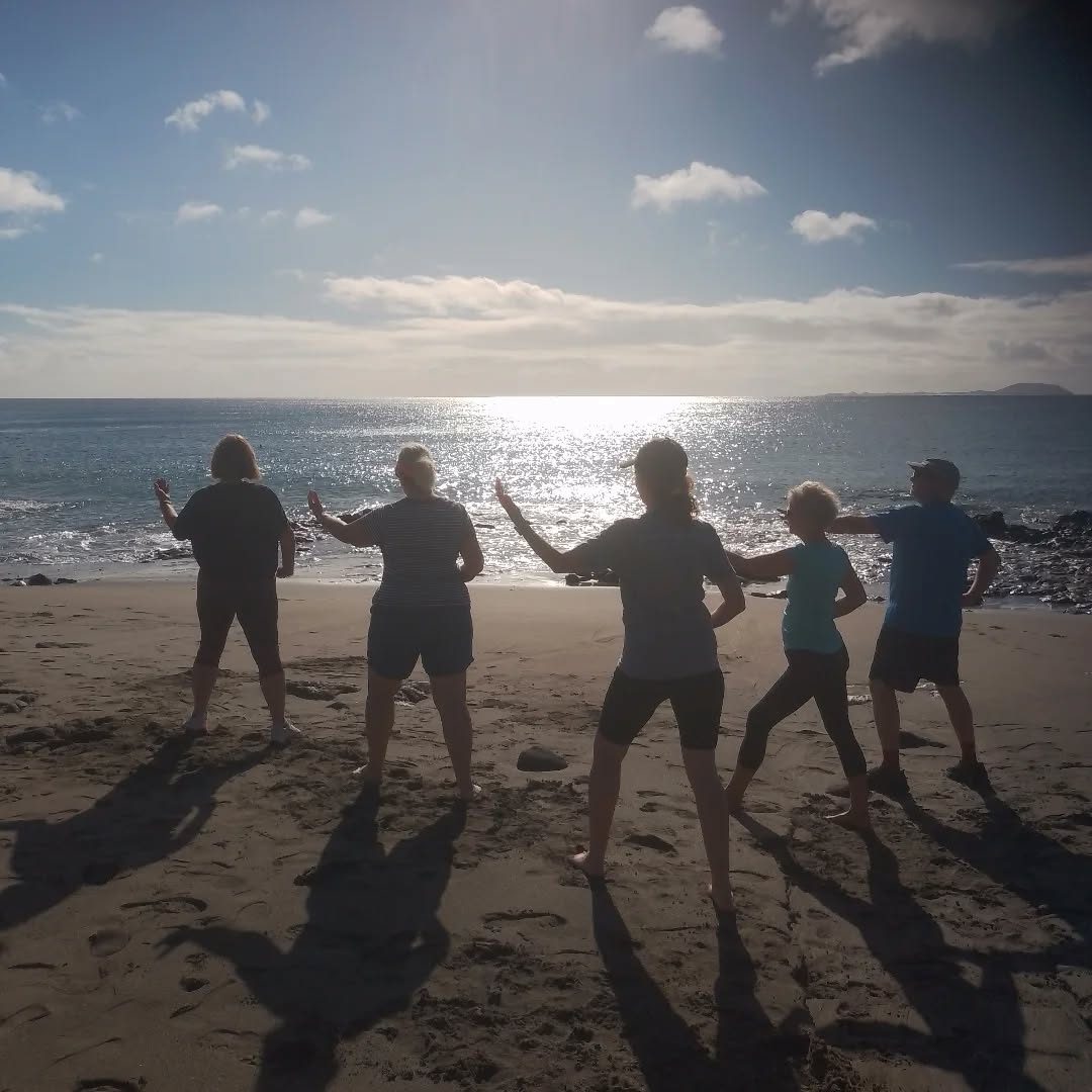 Tai Chi at sunset on the beach in Playa Blanca